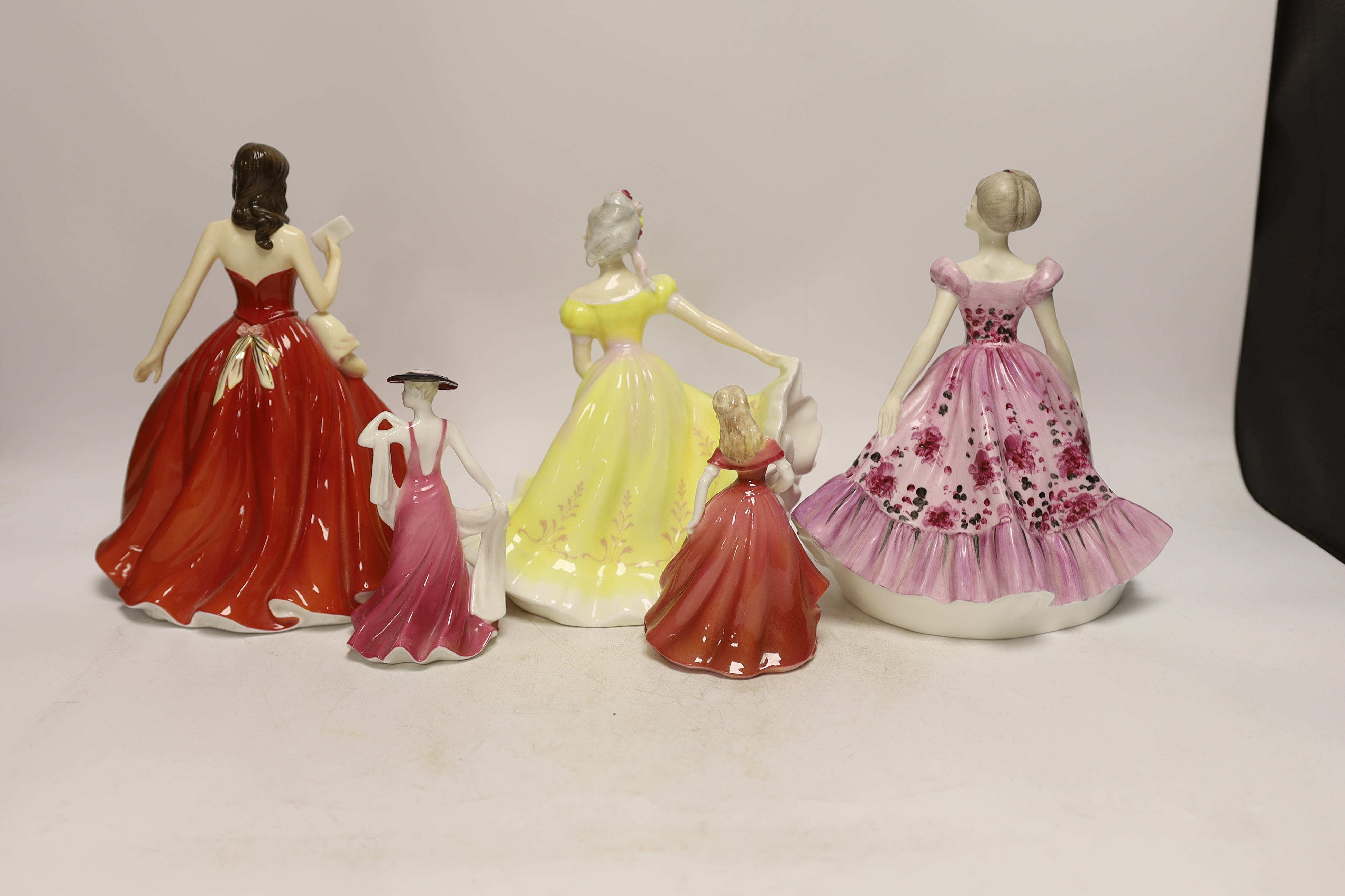 Three Coalport figurines and two Royal Doulton similar figurines